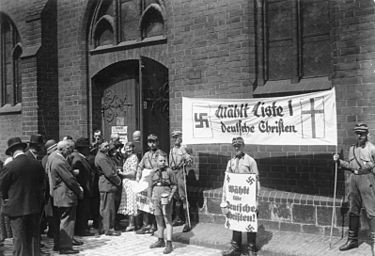 اضغط على الصورة لعرض أكبر.   الإسم:	Bundesarchiv_Bild_183-1985-0109-502,_Kirchenwahl.-_Propaganda_der__Deutschen_Christen__in_Berlin.jpg  مشاهدات:	0  الحجم:	34.1 كيلوبايت  الهوية:	822523