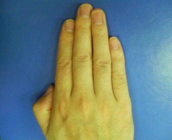 This is a male hand. Notice that his ring finger is longer than the index.